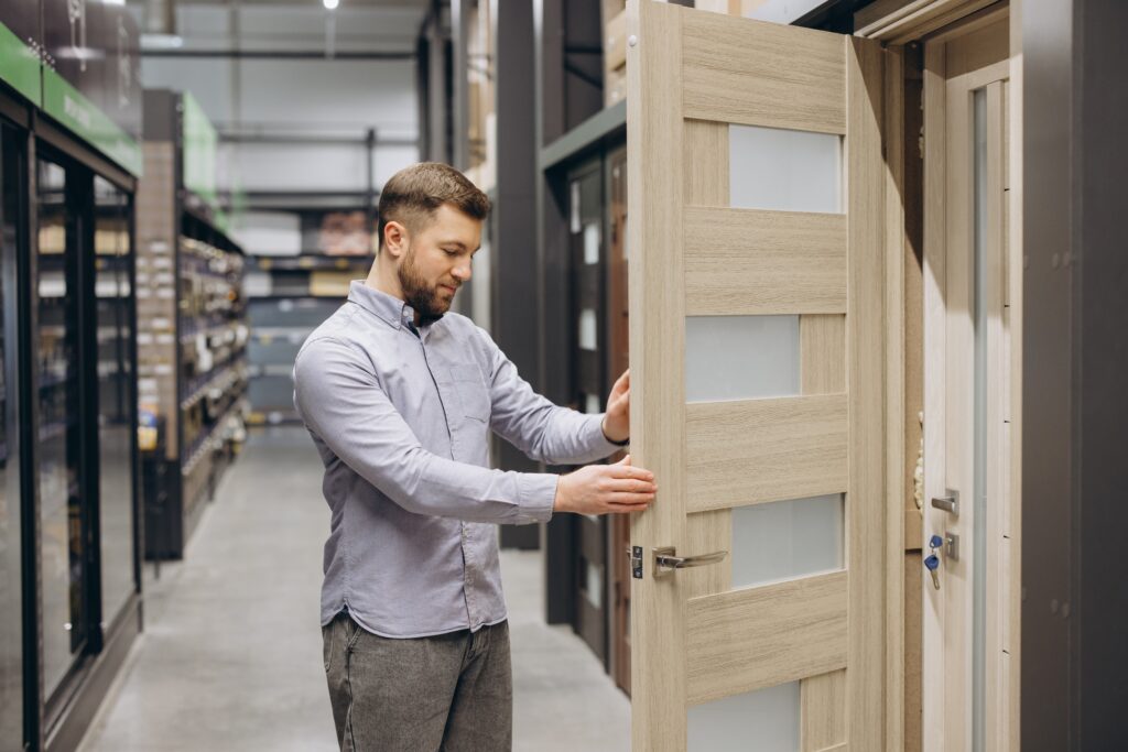 business owner reviewing commercial doors in Baton Rouge before installation